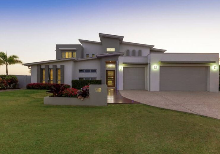 Modern multilevel house exterior at dusk