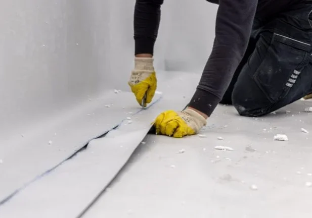 man working to get he home waterproofing done